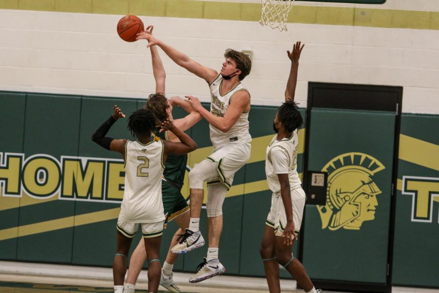 Pete Moe '22 swats a Kennedy layup against the Cougars on Feb. 11.