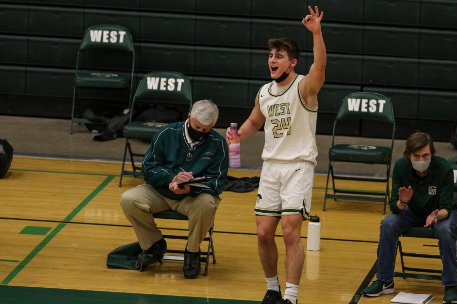 Grahm Goering '21 celebrates a Kareem Earl '24 three against Kennedy on Feb. 11.