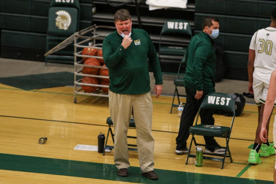 Head coach Steve Bergman calls plays from the sideline after a timeout against Kennedy on Feb. 11.