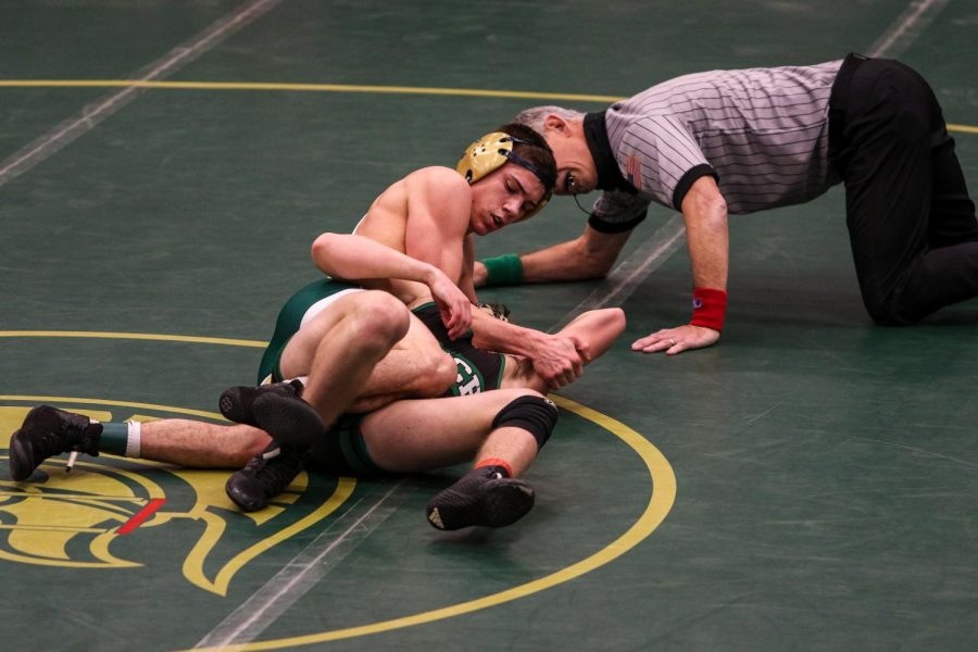 Graham Gambrall '21 pins Pella's Quinn Rhamy in the district semifinals on Feb. 13