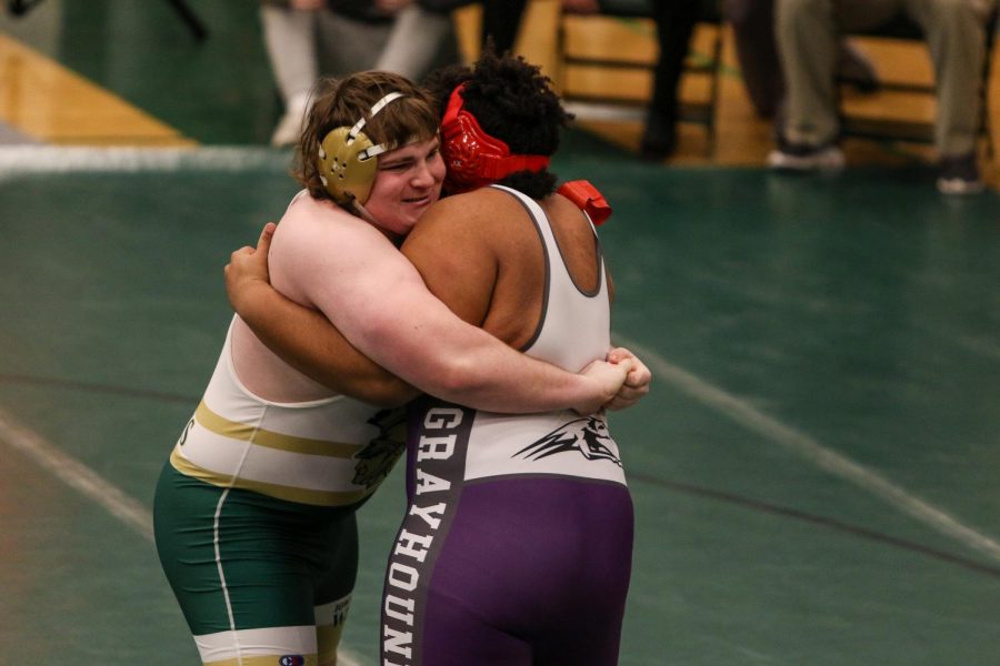 Ben Alden '21 tightens his grip while wrestling Burlington's Julius Harris '22  during the district wrestling meet on Feb. 13. 