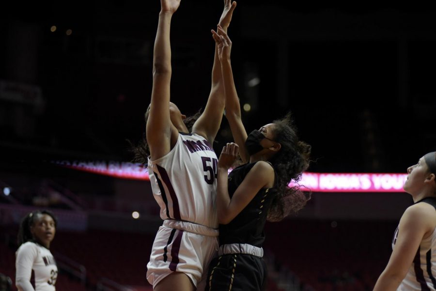 Meena Tate 23 goes up for points against Waterloo West March 1.