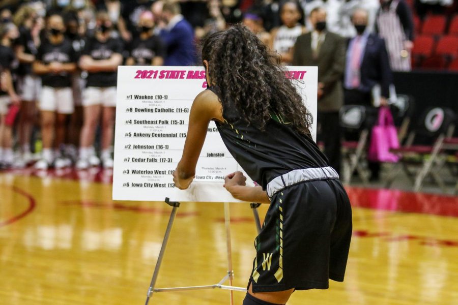 Meena Tate '23 advances the Trojans to the state semifinals after the state quarterfinal game against Waterloo West on March 1.