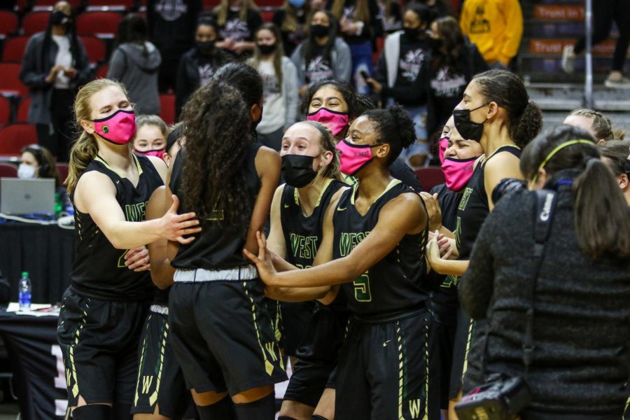 Meena Tate '23 and her teammates celebrate after advancing to the state semifinals on March 1.