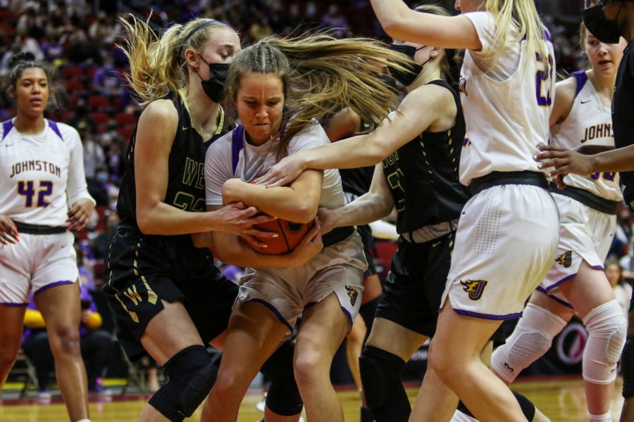 Audrey Koch '21 and Jenna Saunders '21 fight for a jump ball during the state semifinal game against Johnston on March 4.