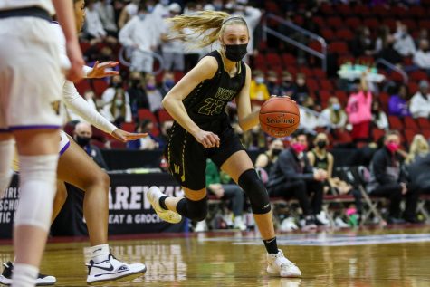 Audrey Koch 21 drives into the lane looking to score during the state semifinal game against Johnston on March 4.