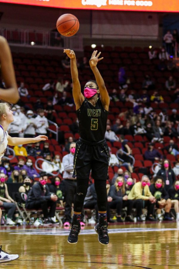 Emma Ingersoll-Weng '22 shoots a three from the top of the key during the state semifinal game against Johnston on March 4.