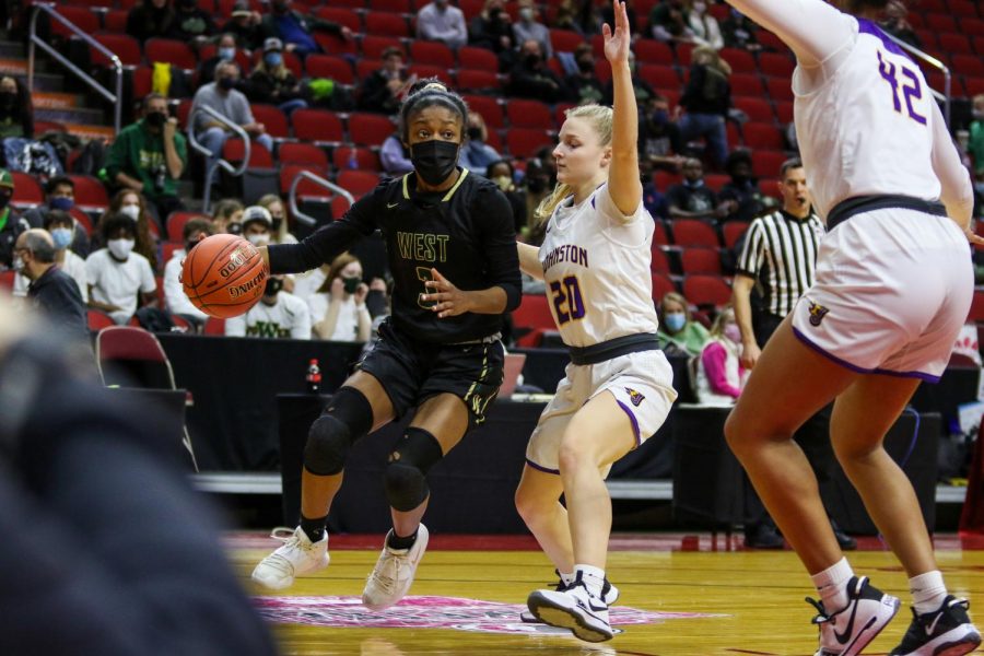 Matayia Tellis '21 drives baseline into a double team during the state semifinal game against Johnston on March 4.