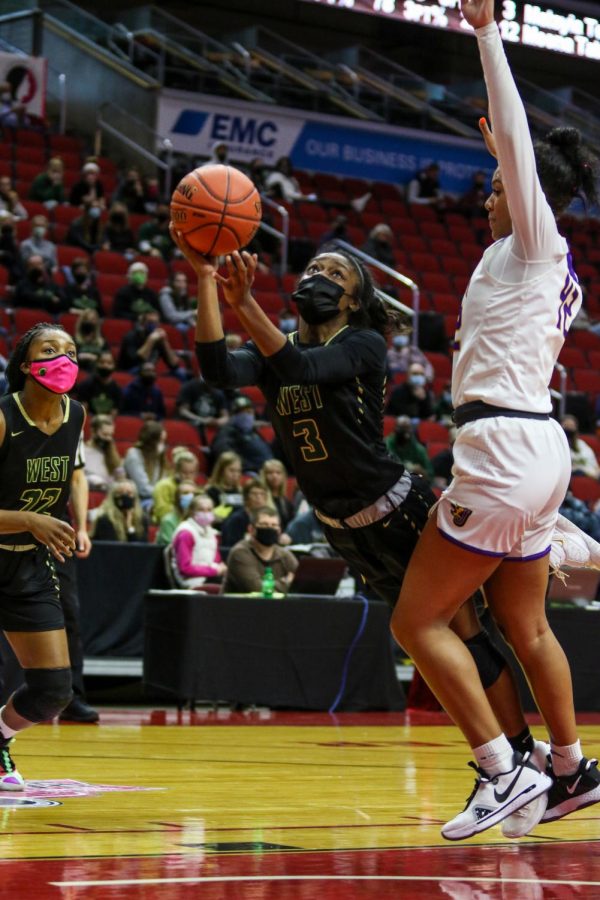 Matayia Tellis '21 throws up a shot as she gets fouled during the state semifinal game against Johnston on March 4.