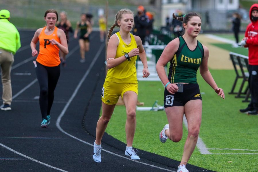 Maddy Negley '21 settles in while running in the 3000 meter race during the Iowa City West Invitational on March 30.