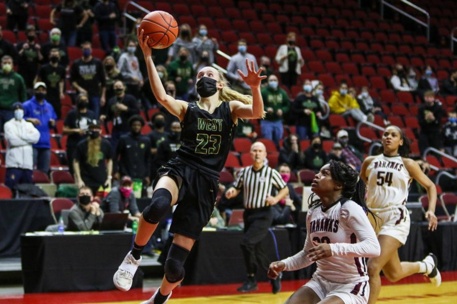 Audrey Koch '21 goes up for a transition layup during the state quarterfinal game against Waterloo West on March 1.