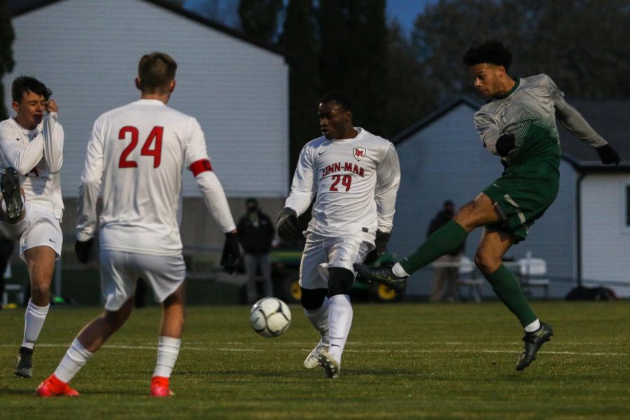 Kolby Godbolt '21 launches a shot on goal against Linn-Mar on April 20 at Ed Barker Field.