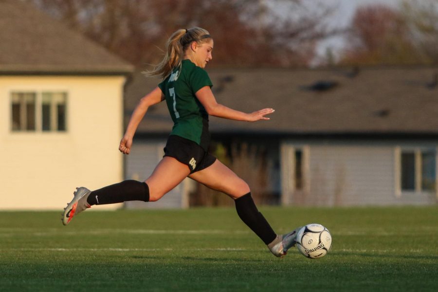 Jada Dachtler '22 passes the ball ahead on the offensive end against City High at Ed Barker Field on April 22.