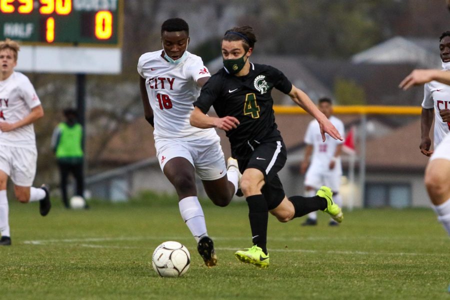 Miguel Cohen-Suarez '22 gets past his defender looking to pass against City High at Ed Barker Field on April 23. 