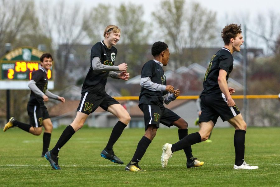 Owen Smith '21 yells out of excitement after heading the ball into the back of the net against City High at Ed Barker Field on April 23. 