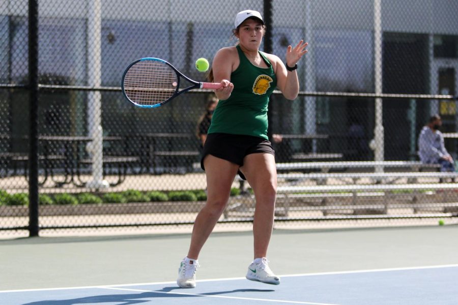 Sophomore Zola Gross looks to score on a return against City High at the Hawkeye Tennis and Recreation Center on April 29.