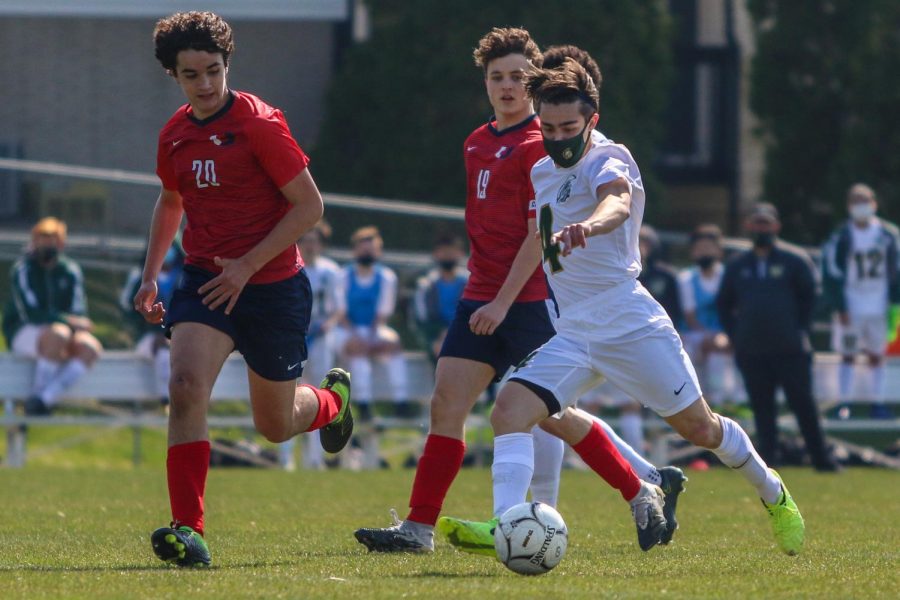 Miguel Cohen Suarez '22 gets ready to take a shot against Urbandale on April 3 during the Iowa City West Classic.