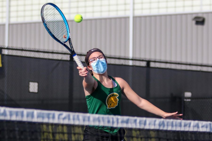 Julianna Mascardo '23 reaches to make a play on the ball against City High at the Hawkeye Tennis and Recreation Center on April 29.