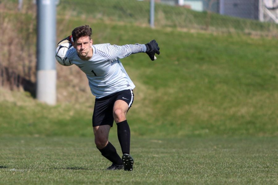 Nick McDonnell '22 throws the ball to his teammate after making a save against Ankeny Centennial on April 3 during the Iowa City West Classic.