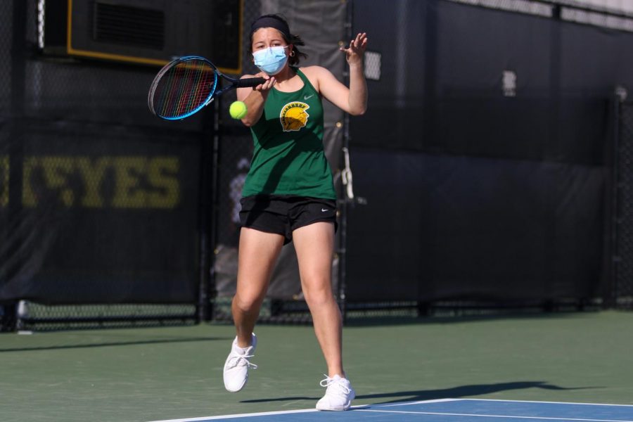 Caroline Mascardo '22 takes a swing at the ball as she looks to score against City High at the Hawkeye Tennis and Recreation Center on April 29.