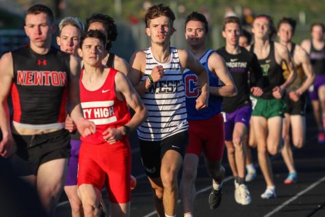 Caden Noeller 22 settles into the pack while running the 800 meter race during the Eastern Iowa Track and Field Festival on April 12.