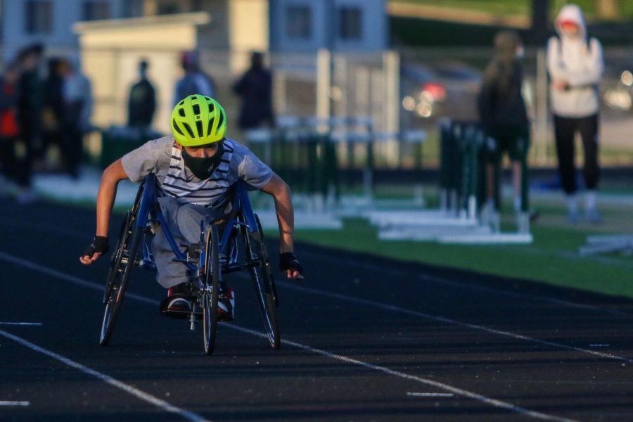 Jordan Caperon ’23 competes in his first ever 100 meter race during the Eastern Iowa Track and Field Festival on April 12.