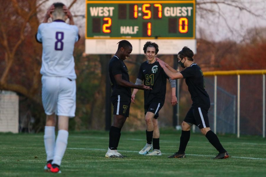 Miguel Cohen Suarez 22, Michael Nelson 23 and Marko Migambi 21 celebrate a goal towards the end of the first half against Liberty on April 13.