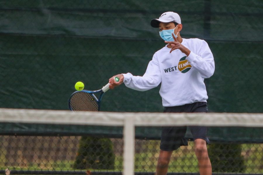 Samir Singh '24 eyes the ball on his forehand shot against Cedar Rapids Washington on April 14.