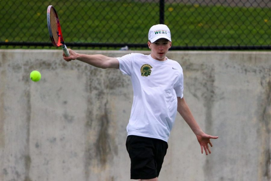 Ryan Kirkpatrick '24 looks to score with his backhand shot against Cedar Rapids Washington on April 14.