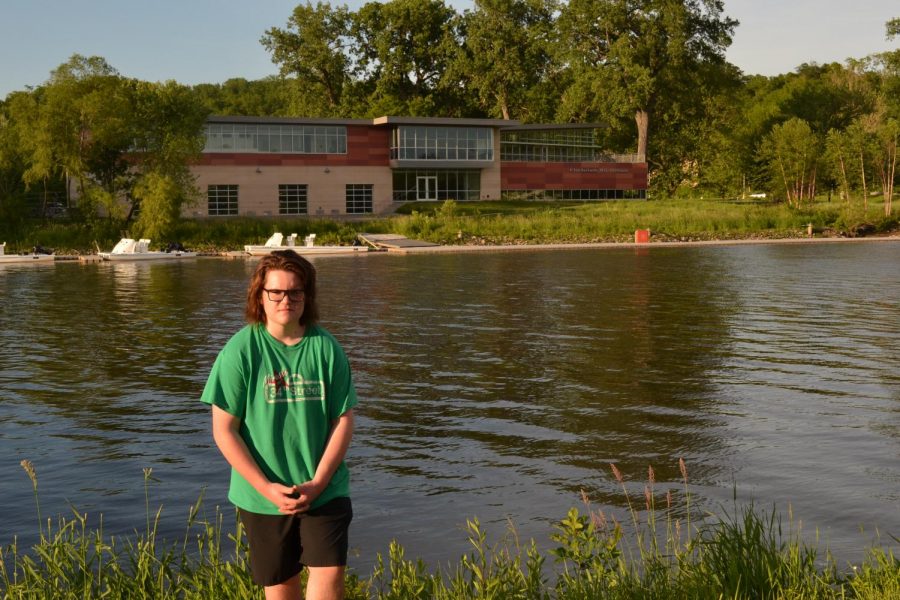 Cormac Nabhan-Warren ’22 stands outside of the Beckwith Boathouse where he will row over the summer.
