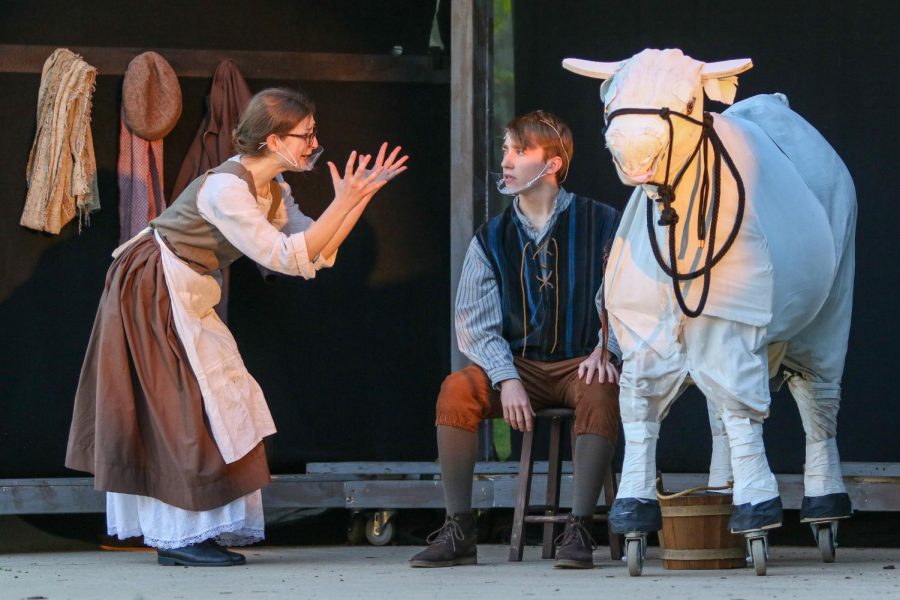 Sarah Dickens '21 and Charlie Duffy '21 preform in "Into the Woods" in the West High courtyard on May 13. 