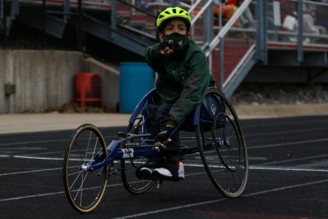 Jordan Caperon 23 points to the scoreboard after finishing the 100 meter race on April 15 at the Forwald Coleman Relays. 