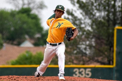 Marcus Morgan 21 delivers a pitch in the Trojans season opener against Bettendorf on May 24.