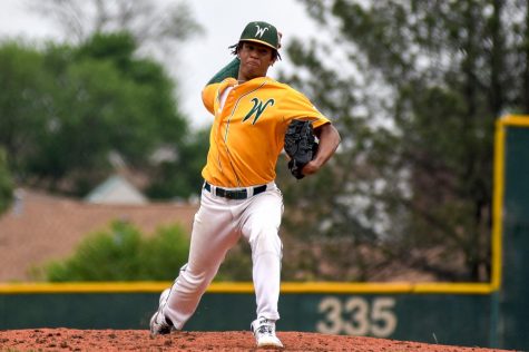 Marcus Morgan '21 delivers a pitch in the Trojans' season opener against Bettendorf on May 24.