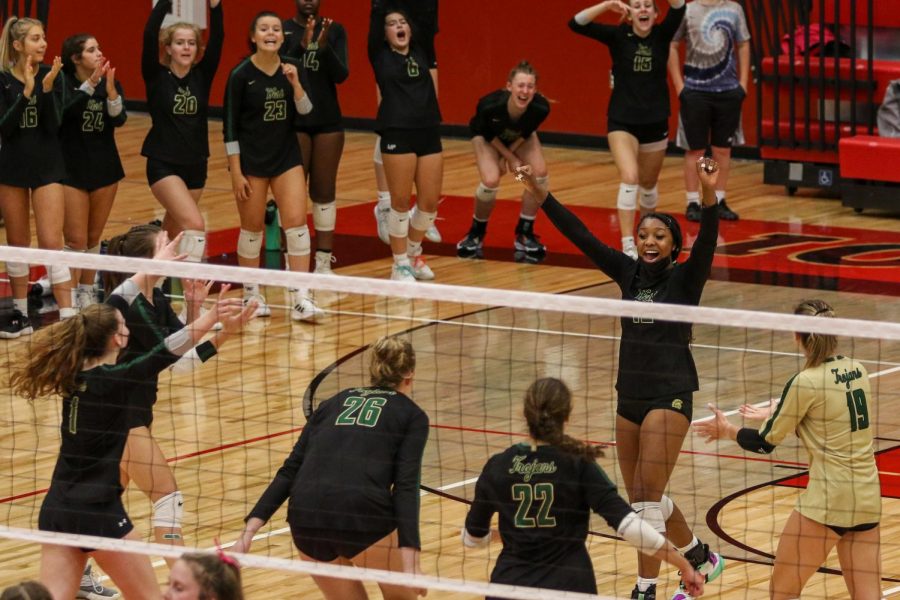 Melae' Lacy '24 celebrates a point with her teammates during the Battle for the Spike at City High on Sept. 30.