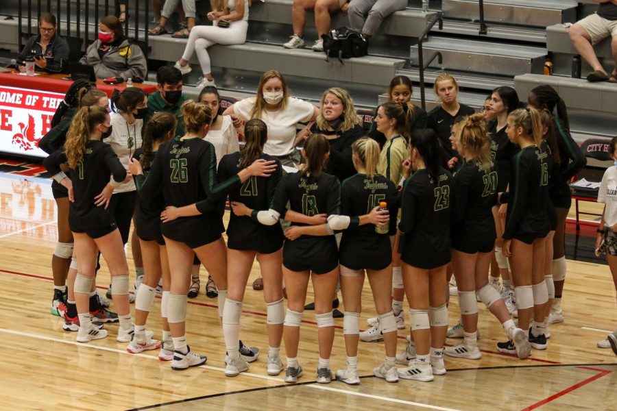 Head Coach Keeley Arnold addresses her players during a timeout during the Battle for the Spike at City High on Sept. 30. 