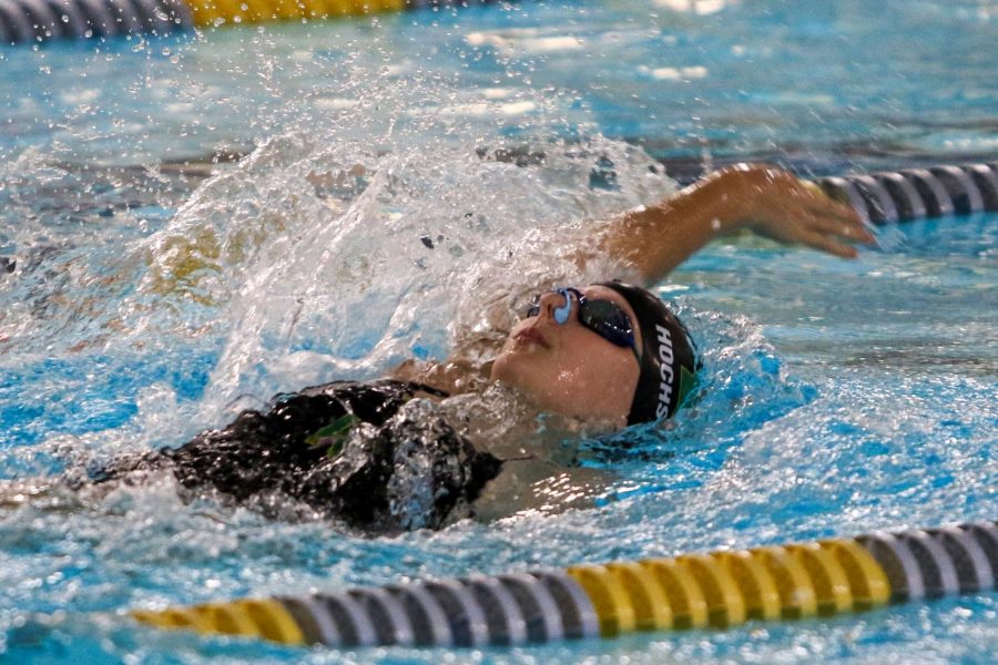 Ella Hochstetler '22 swims in the 100 yard backstroke on Sept. 2 in a dual meet against Waterloo at the Coralville Rec Center.