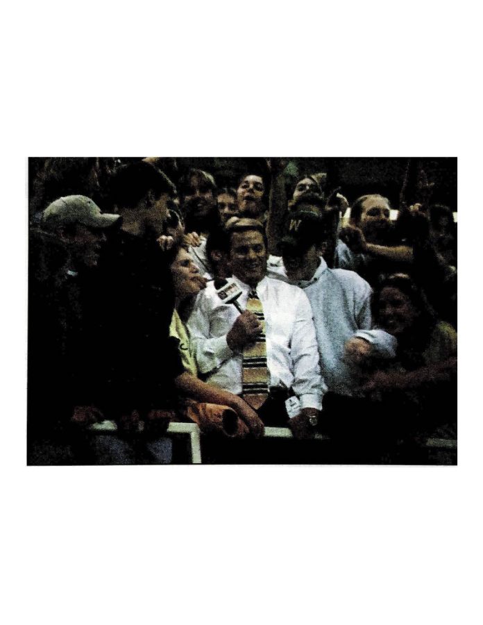 West students swarm a KCRG reporter at the UNI-Dome in 1998.