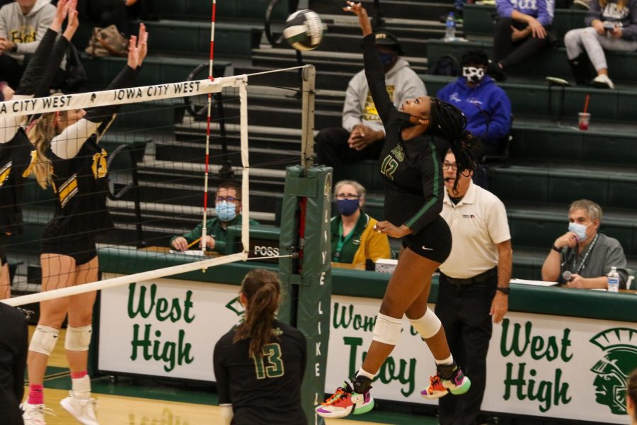 Melae' Lacy '24 picks up a big kill on Oct. 21 during the regional semifinal against Bettendorf.