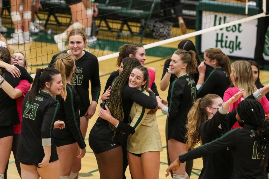 Melae' Lacy '24 and Katherine Kouba '22 hug after playing in their last home game of the season against Bettendorf on Oct. 21 in the regional semifinal. 