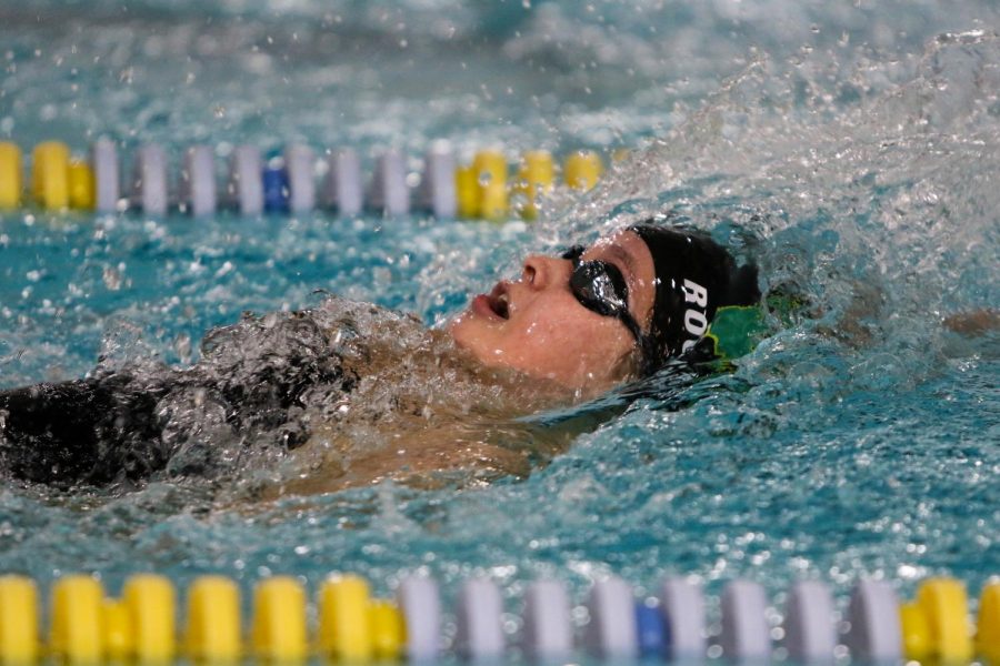 Jade Roghair '23 swims in the 100 yard backstroke on Oct. 19 during a dual meet against City High.