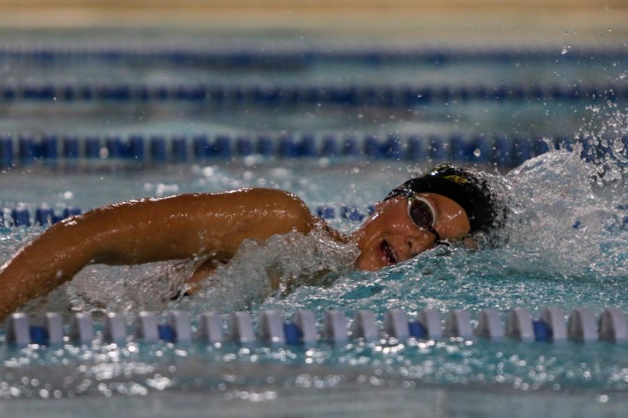 Scarlet Martin '22 dominates the 100 yard freestyle on Oct. 19 during a dual meet against City High.