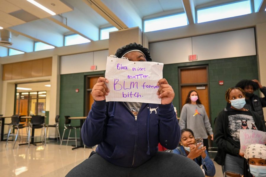 A student holds up their sign at the protest.
