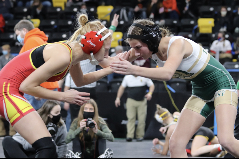 Marissa Goodale 22 stares down her opponent while wrestling at the third annual state tournament in Coralville.