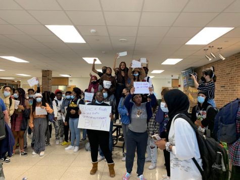 Protesters protesting racism at West High gather in the commons after marching through the halls. 
