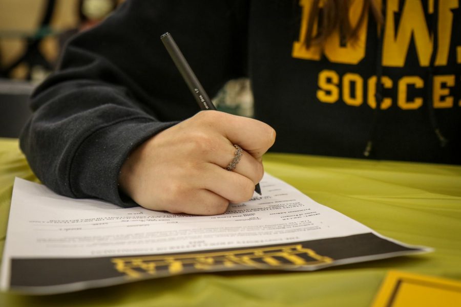 Makenna Vonderhaar 22 signs her National Letter of Intent during the signing ceremony in the cafeteria after school on Nov. 10.