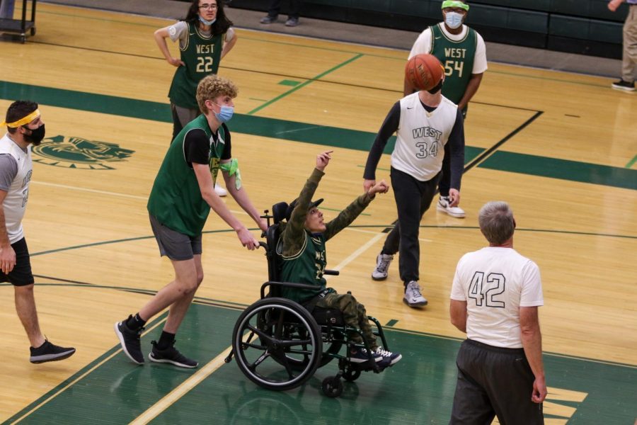 Jordan Caperon '23 knocks down a shot during the PALS and Community Inclusion Club's annual basketball game against the faculty on Nov. 11.