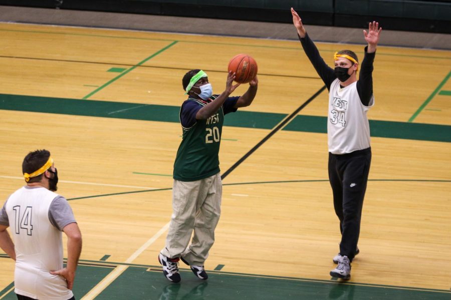 Byamungu Omari '20 knocks down a mid range jumper during the PALS and Community Inclusion Club's annual basketball game against the faculty on Nov. 11.