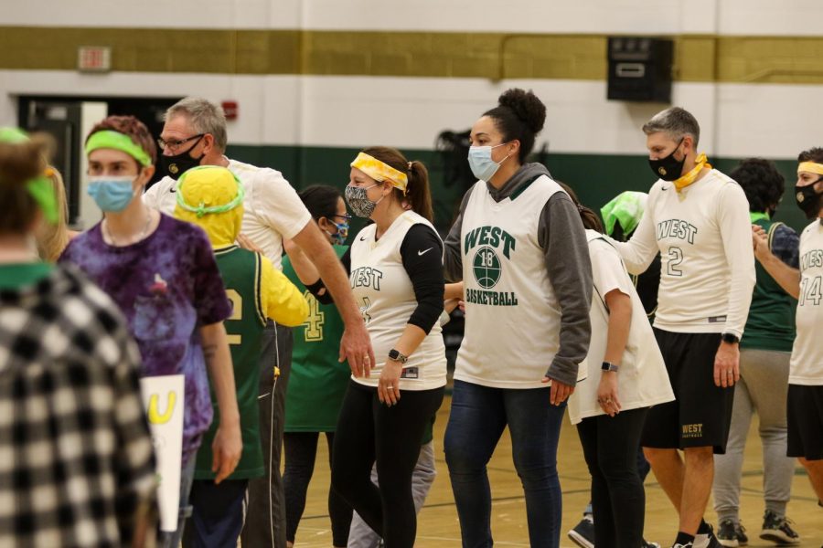 The students and faculty teams shake hands after the PALS and Community Inclusion Clubs annual basketball game against the faculty on Nov. 11.