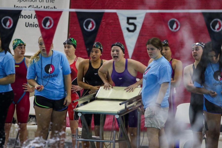 Carlee Wilkins 24 cheers on her 200 medley relay temmates during the IGHSAU State Swimming and Diving Championships in Marshalltown on Nov. 13.